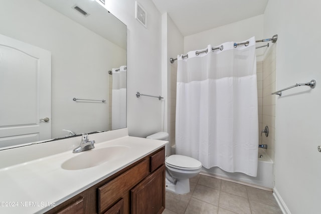 full bathroom with toilet, vanity, tile patterned flooring, and shower / tub combo with curtain