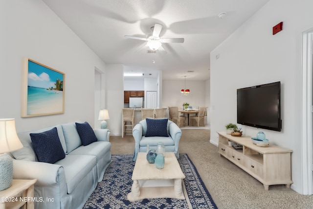 living room featuring ceiling fan and carpet flooring