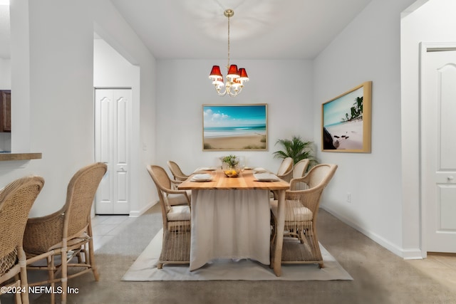 carpeted dining space featuring a chandelier