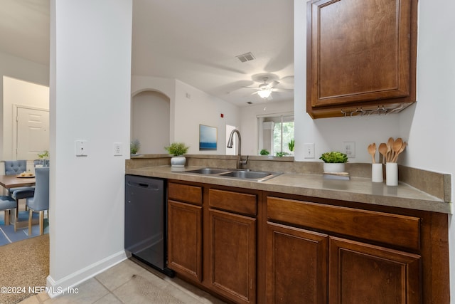 kitchen with ceiling fan, light tile patterned floors, sink, and black dishwasher