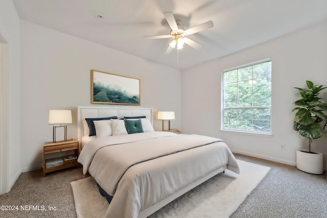 bedroom with ceiling fan and carpet flooring