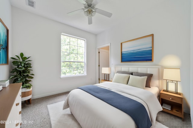 bedroom with ceiling fan and light colored carpet