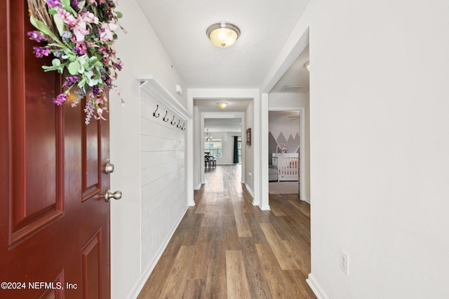 hallway featuring dark wood-type flooring