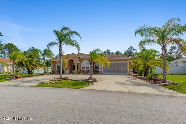 mediterranean / spanish-style house featuring a garage