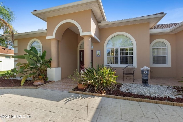 property entrance with a patio