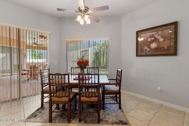 tiled dining space featuring ceiling fan