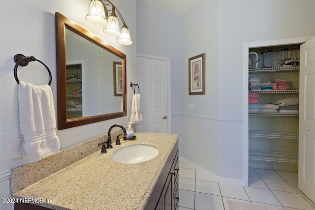 bathroom featuring tile patterned flooring and vanity