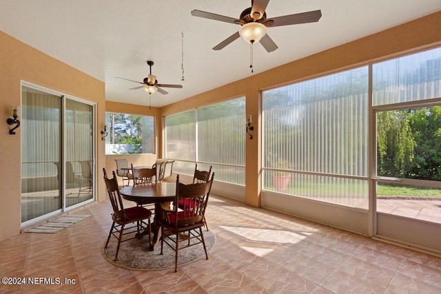 sunroom with a wealth of natural light and ceiling fan