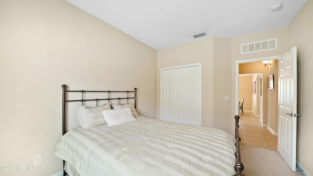 carpeted bedroom featuring a closet