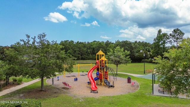 view of play area featuring a lawn