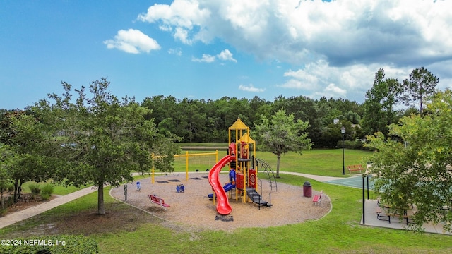 view of play area featuring a lawn