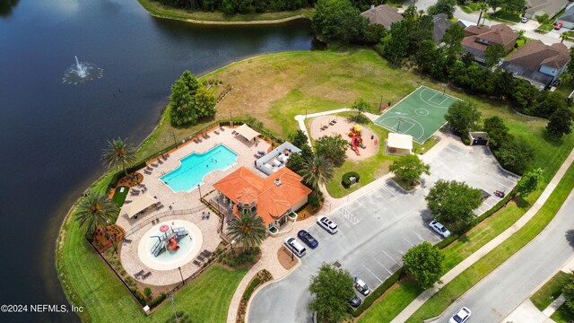 birds eye view of property featuring a water view