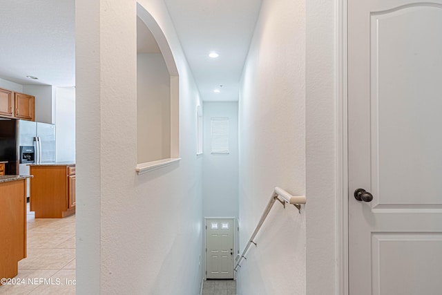 hall with light tile patterned flooring