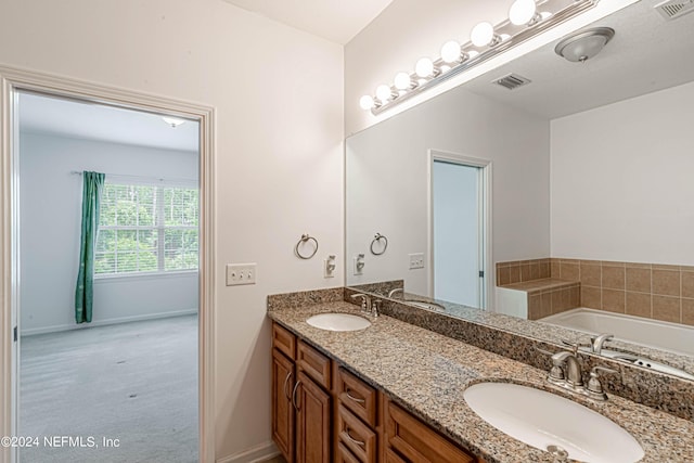 bathroom featuring a bathtub and vanity