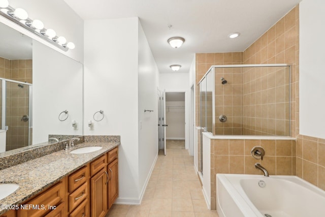 bathroom with vanity, shower with separate bathtub, and tile patterned flooring