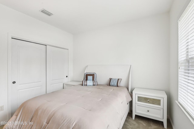 bedroom featuring a closet and carpet flooring