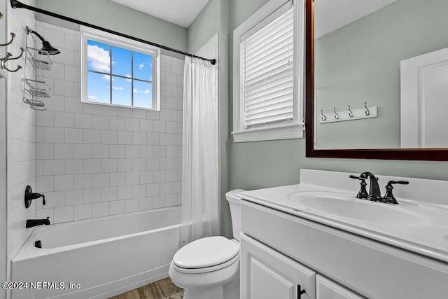 full bathroom with vanity, toilet, wood-type flooring, and shower / bath combo