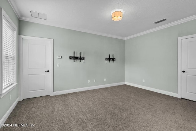 empty room with carpet flooring and crown molding