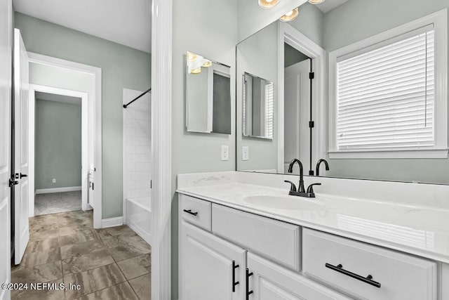 bathroom with vanity and bathing tub / shower combination