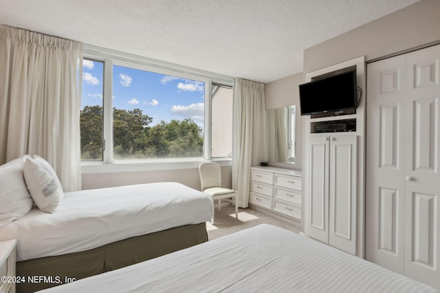 bedroom featuring a textured ceiling