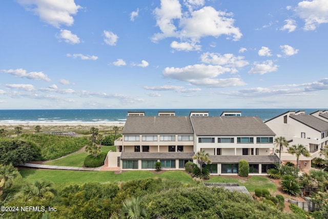 bird's eye view featuring a water view and a view of the beach