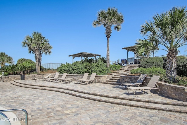 view of home's community with a patio