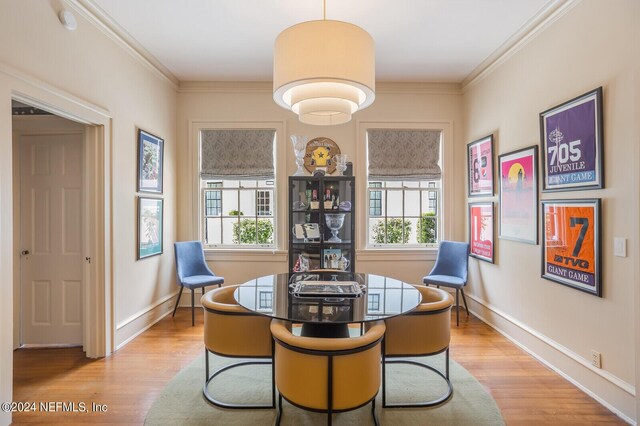 interior space with ornamental molding and light hardwood / wood-style flooring