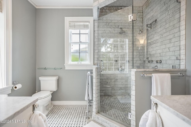 bathroom with a shower with door, vanity, and toilet