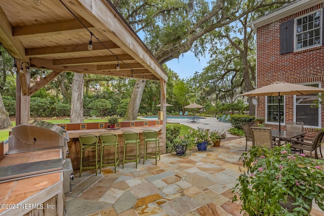 view of terrace featuring a bar