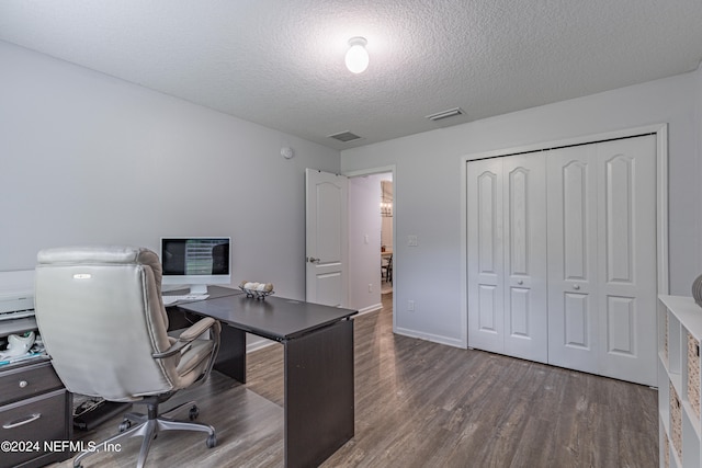 office area featuring a textured ceiling and wood-type flooring