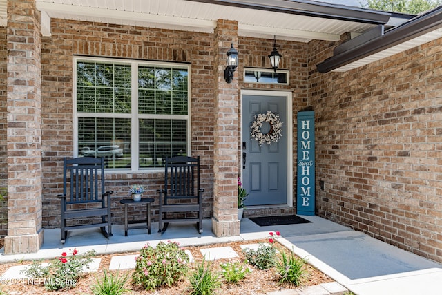 property entrance featuring covered porch