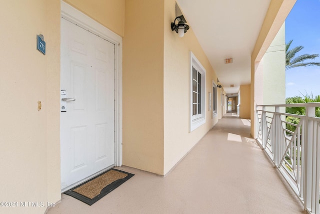 entrance to property with a balcony