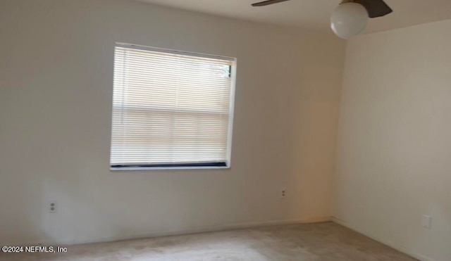 empty room with carpet floors and ceiling fan