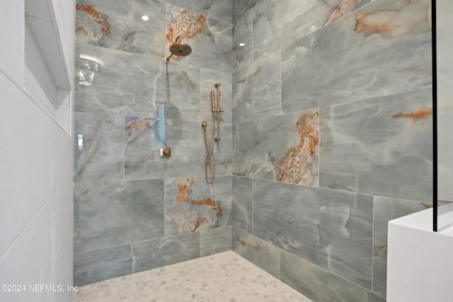 bathroom featuring tiled shower