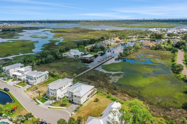 drone / aerial view with a water view