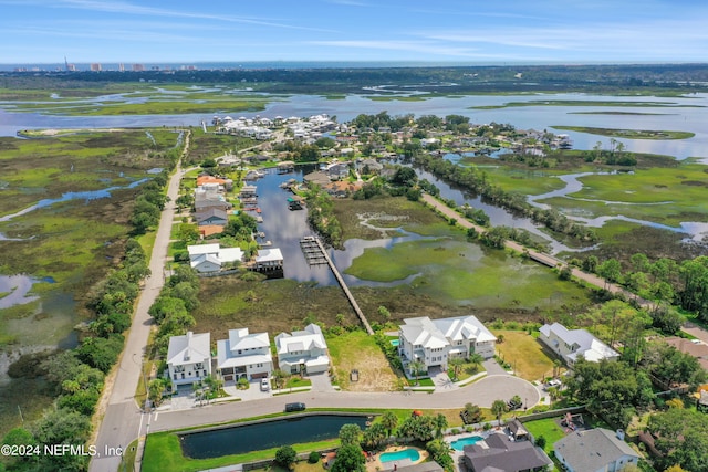 drone / aerial view with a water view