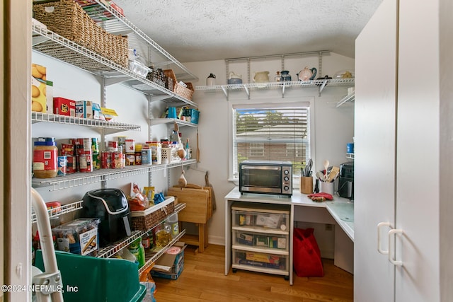 storage area featuring a toaster