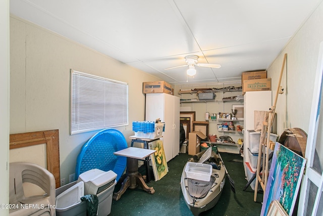 misc room featuring ceiling fan and concrete floors