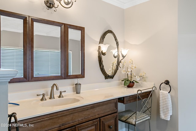 bathroom with vanity and crown molding