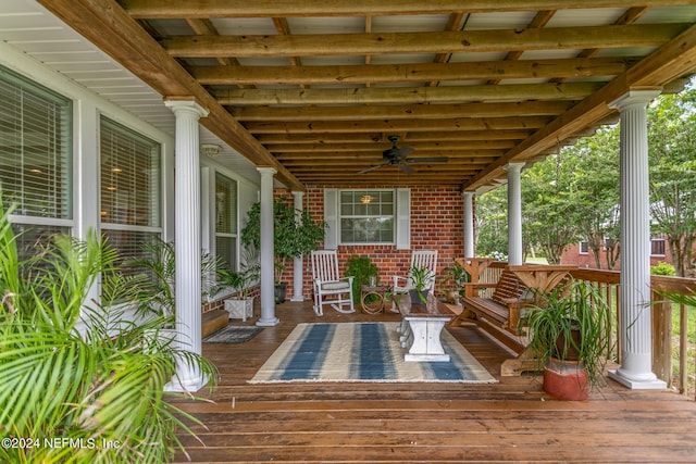 deck with covered porch and a ceiling fan