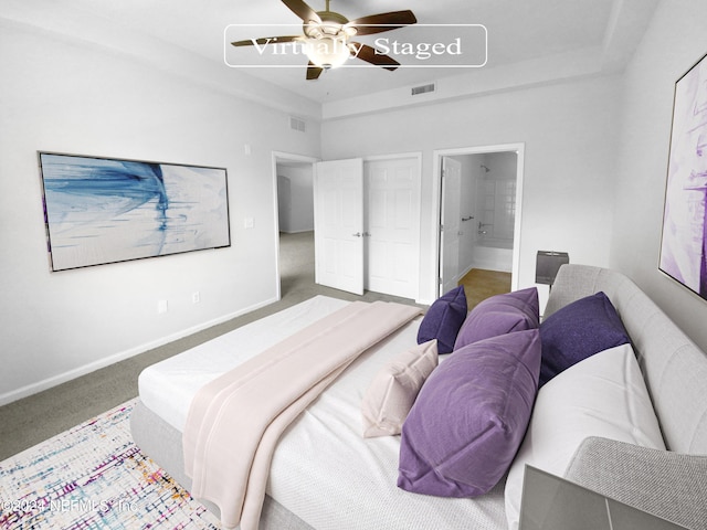 bedroom featuring ensuite bath, ceiling fan, and carpet flooring