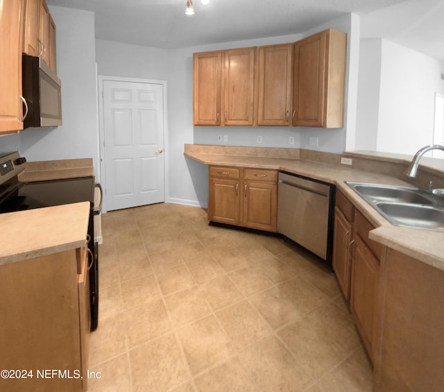 kitchen with sink and appliances with stainless steel finishes