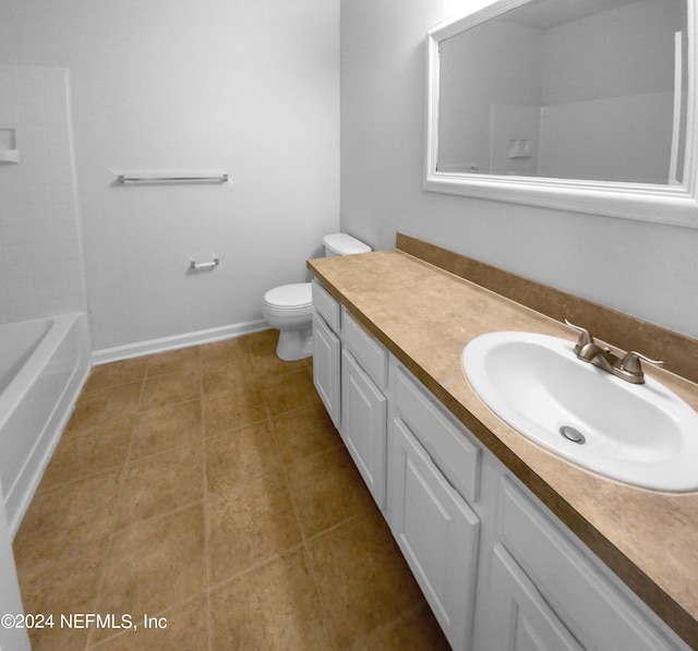 bathroom featuring toilet, vanity, and tile patterned flooring