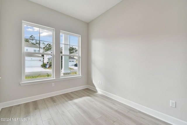 unfurnished room featuring light wood-type flooring