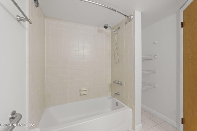 bathroom with tile patterned flooring and tiled shower / bath