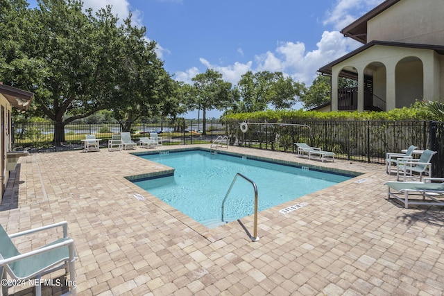 view of pool featuring a patio