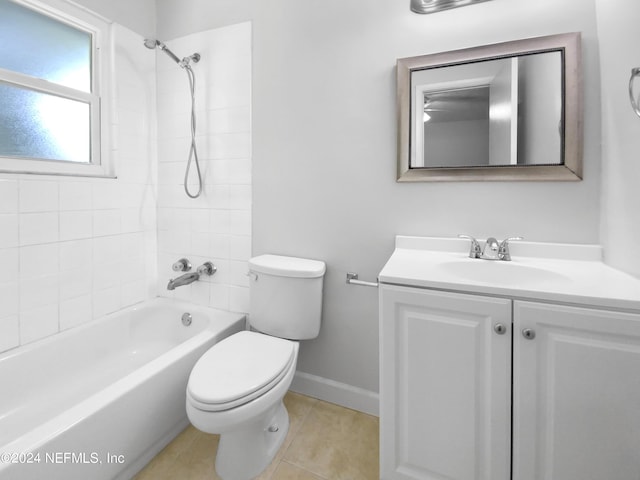 full bathroom with toilet, tiled shower / bath, tile patterned flooring, and vanity