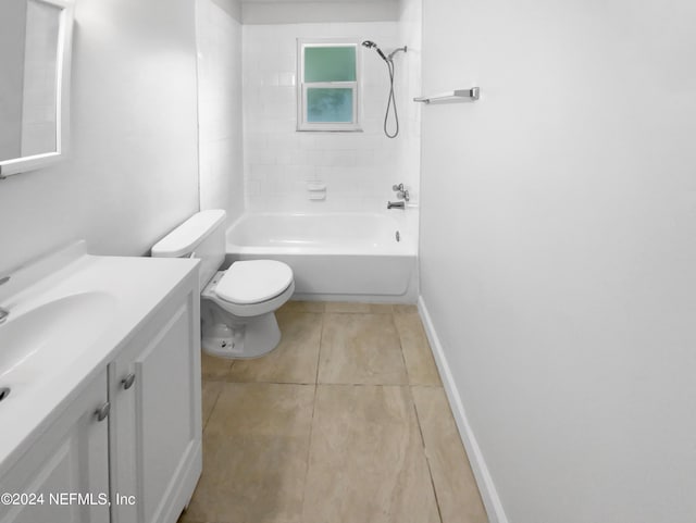 full bathroom with toilet, tile patterned flooring, tiled shower / bath, and vanity