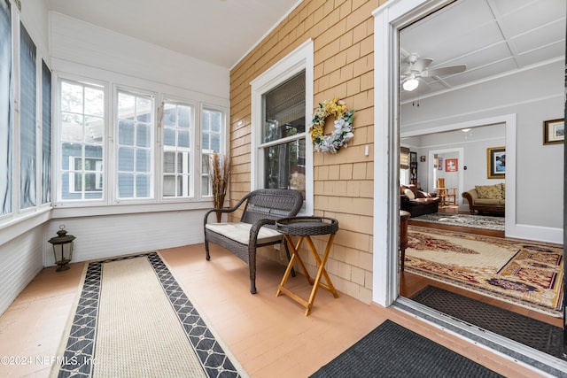 sunroom with ceiling fan