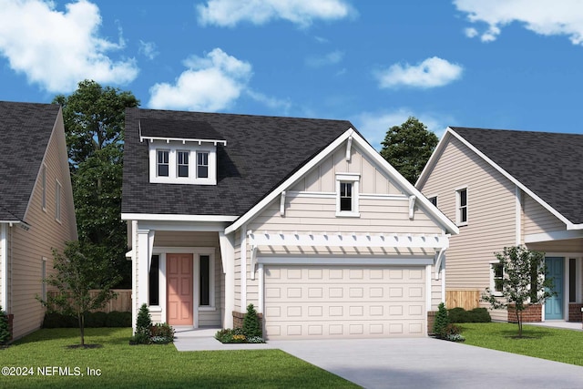 view of front of home with a garage and a front yard